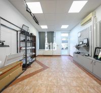Commercial premises with displayed lighting products and ceramic flooring.
