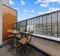 The balcony in the 1-room apartment offers a view of Zuzany Chalupovej Street in Bratislava V.