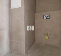 Floor tiling and preparation for sanitary installation in offices.