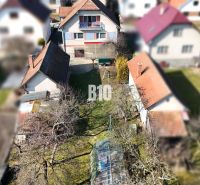 A family house in Turany with a yard, garden, and surrounding houses.