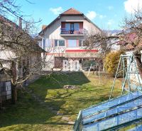 A family house in Turany with a spacious garden, greenhouse, and swing.