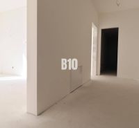 A bright hallway with white walls in a 3-room apartment.
