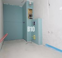 The interior of a 3-room apartment with an unfinished bathroom featuring installations and drywall.