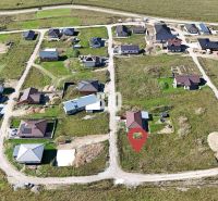 Aerial view of developing residential land in Necpaly with building plots.