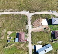 Aerial view of properties - housing in Necpaly with visible new house constructions.