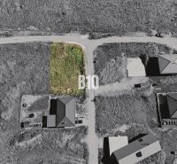 Aerial view of a building plot in Necpaly designated for residential use.
