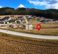 A locality with family houses on plots, suitable for living in a natural environment.