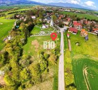 Aerial view of a rural residential area with a natural environment and scattered houses.