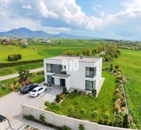 A family house in Rakovo surrounded by green plots suitable for living.