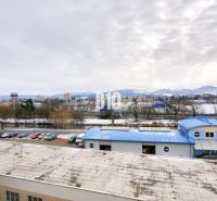 A view of the winter scenery of the city of Martin from Timravy Street with industrial buildings.