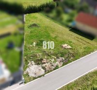 Residential plots in Diaková, green area by the asphalt road.