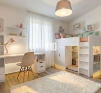 Children's room in a family house with a loft bed and a floor with a wooden decor.