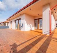 A family house in Beladice with a terrace and a wooden decor floor.