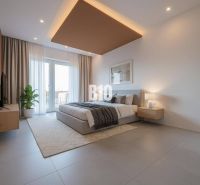 Bedroom in a family house with a large window, gray floor, and a plant.