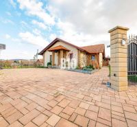 A family house in Nitra with a spacious yard and a basketball hoop in front of the entrance gate.