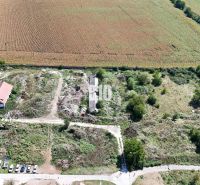 A rural area near Levice with agricultural and forest lands, surrounded by fields and roads.