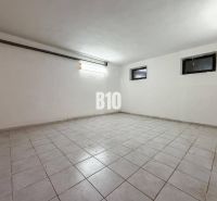 Empty room with white walls and tiles in a family house.