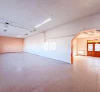 Spacious commercial premises with tiles and large windows, suitable for business.