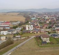 Aerial view of a residential area in Rosina with houses and greenery. Plots - housing.