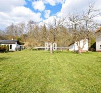 A spacious grassy plot with fruit trees for living in Raková.