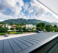 View from the balcony in Terchová of the mountains and houses, a space suitable for a studio apartment.