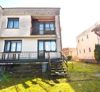 A family house in Žilina with a terrace, lawn, and stairs leading to the garden.