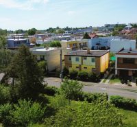 A view of family houses on Nabr. J. M. Hurbana in Michalovce surrounded by greenery.
