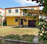 Yellow family house with a garage and terrace on Nabr. J. M. Hurbana Street in Michalovce.