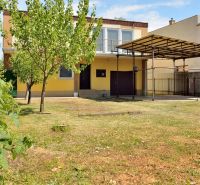 A family house on Nabr. J. M. Hurbana street in Michalovce with a lawn and a shelter.