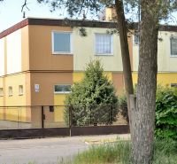 A family house on Nabr. J. M. Hurbana in Michalovce, surrounded by greenery with a fence.
