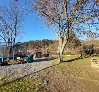 Playground with a trampoline and trees at L. Svoboda Square in Banská Bystrica.