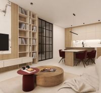 2-bedroom apartment with a library, marble decor, and a kitchen with red chairs.