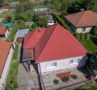 A family house in Golianovo on Golianovo Street with a red roof and a garden.
