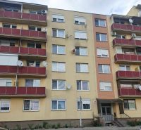 Apartment building on Nábrežná Street in Nové Zámky with red balconies.