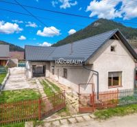 A family house in Stupno with a courtyard, garden, and surrounding hills.
