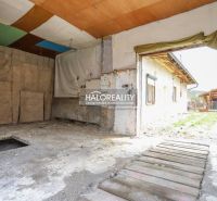 A view of the garage in a family house in Stupno with a makeshift wooden floor.