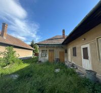 A family house in Bánov on Bánov Street with a grassy yard and a sloped roof.