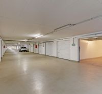 Spacious garages in Bratislava - Petržalka with multiple parking spaces and lighting.