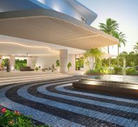 Architectural entrance with a garden and fountain. The apartment development in Phuket offers a luxurious environment.