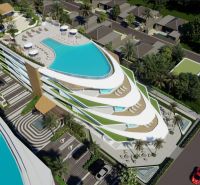 Apartment construction in Phuket with rooftop pools and tropical greenery.