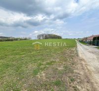 Extensive green plots suitable for living in the village of Bukovec under partly cloudy weather.