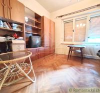 Living room in a family house with furniture and flooring featuring a wood design.