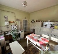 A kitchen in a family house with retro furniture and decorations.