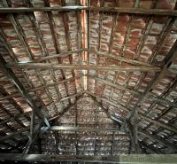 A view of the attic with an old roof structure in a family house.