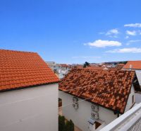 A view of rooftops and the blue sky from a holiday apartment in Vodice.