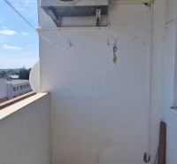 A balcony in a 2-room apartment on Hollého Street in Senec, with air conditioning.