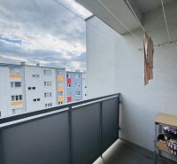 The balcony of a 3-room apartment on Za poštou Street in Hlohovec with a view of the housing estate.