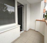 Balcony of a 1-room apartment on Lúčky Street in Holíč with tiles and railing.