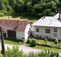 A family house in Belá-Dulice, with an extension, in front of a forest and a garden.