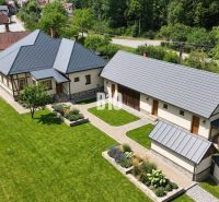 A family house in Belá-Dulice with a large garden and a manicured lawn.